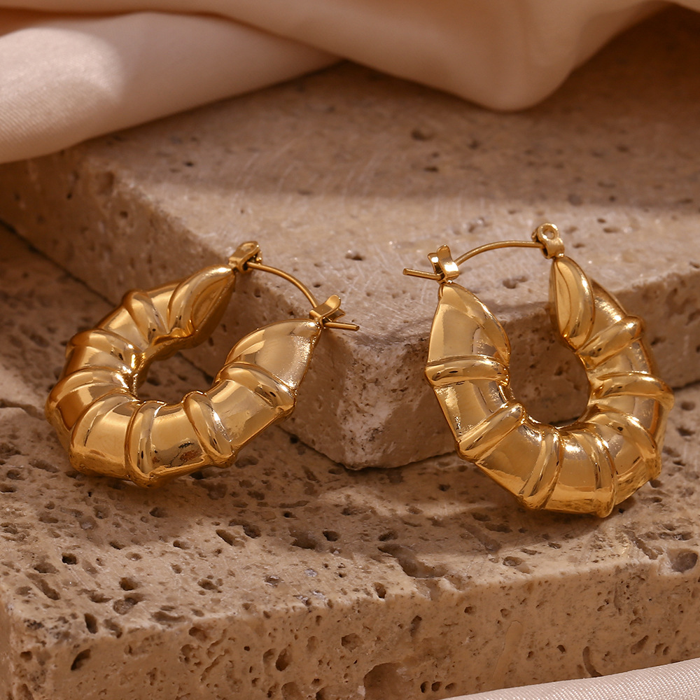 LICA JEWELRY European and American fashion simple personality earrings accessories stainless steel plated 18K gold three-dimensional tire hollow shape