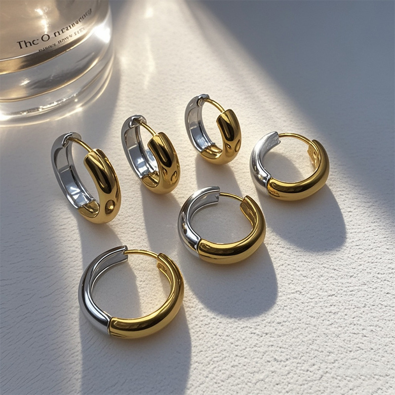 Stainless steel earrings featuring geometric design, highly versatile and luxurious Korean style minimalist trend, with round double-color ear clasps.